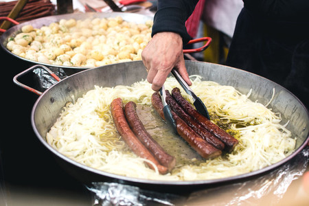 Fried sausages with onion
