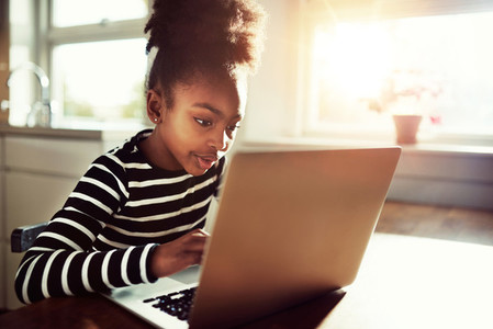 African American School Girl Using her Laptop