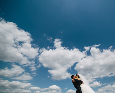 couple on blue sky background