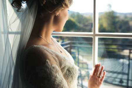 bride looking through the window