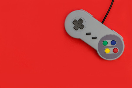 Retro video game controller red background