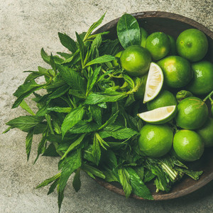 Flatlay of fresh limes and mint  top view  square crop