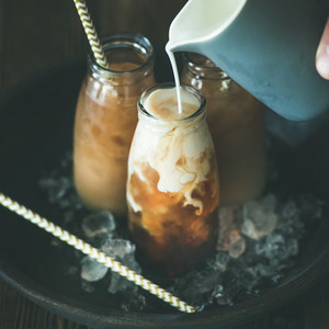 Cold Thai iced tea drink in bottles with milk
