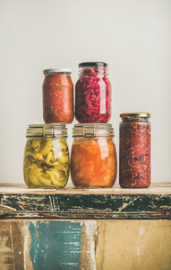 Autumn seasonal pickled or fermented colorful vegetables in jars