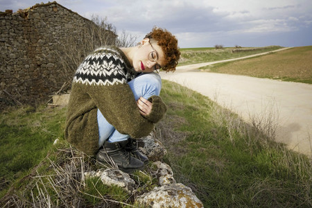Young redhead woman enjoying nature