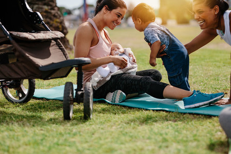 Happy mothers with their babies in a park