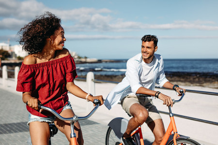 Happy couple riding bicycles