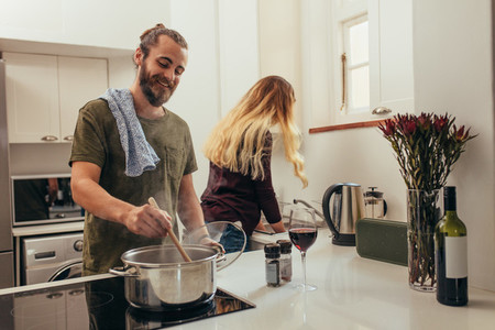 Couple doing kitchen work together at home
