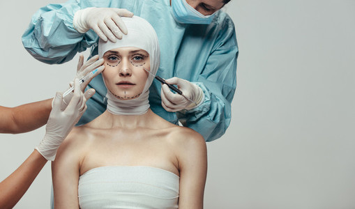 Woman under going face lift surgery