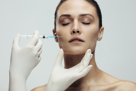 Woman gets beauty facial injections