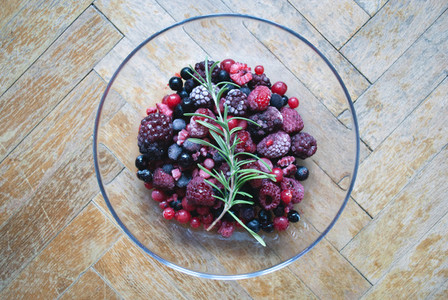 Glass bowl of frozen berries