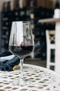 Glass of red wine in a wineshop