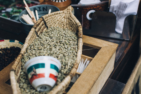 Green coffee beans in basket