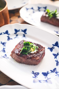 Grilled filet mignon with herbs