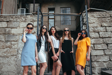 Five young beautiful girls in the city