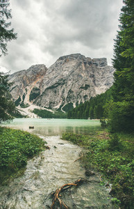 Mountain Lake in Valle di Braies surrounded by green forests