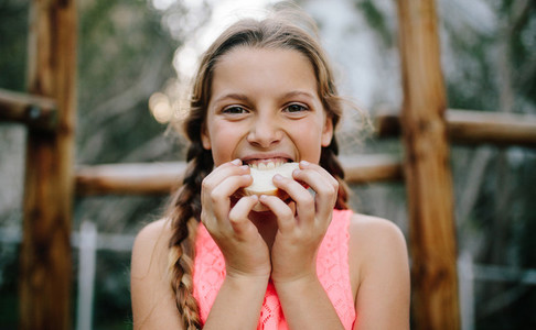Close up of a girl eating sandwich