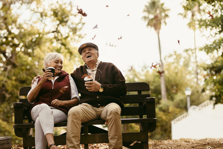 Elderly couple enjoying on picnic at park