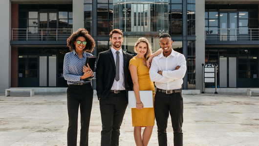 Diverse group of business professionals standing outdoors