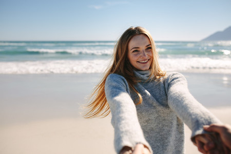 Woman enjoying with boyfriend at the beach