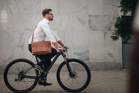 Man commuting to office on bicycle