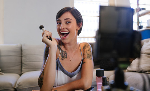 Beauty vlogger recording her video blog episode