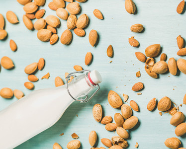 Dairy alternative almond milk in bottle  allergy friendly food concept