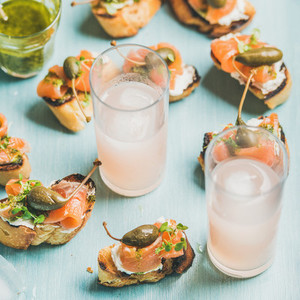 Crostini with smoked salmon and pink grapefruit cocktails  square crop