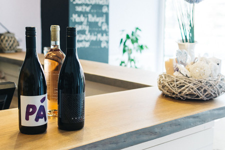 Bottles of wine on a wooden bar