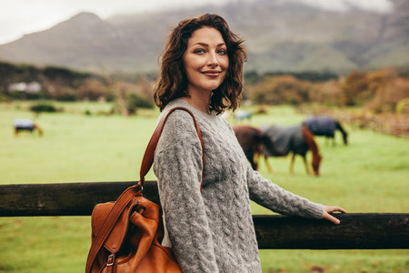 Beautiful woman standing in countryside