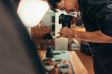 Photographer taking food pictures in studio