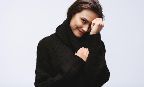 Pretty woman smiling in sweater