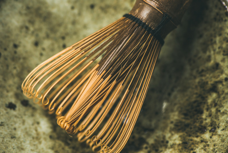 Chasen bamboo whisk, Chawan bowl over grey background