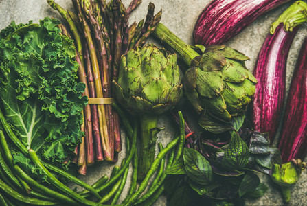 Flat lay of fresh green and purple vegetables  clean eating