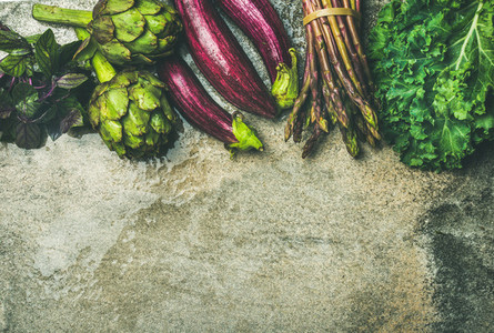 Flat lay of fresh green and purple vegetables  copy space