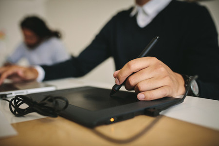 Businessman using digital writing pad