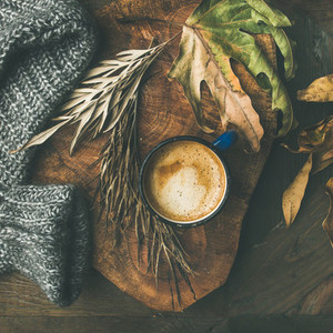 Autumn morning coffee concept with leaves and sweater  square crop