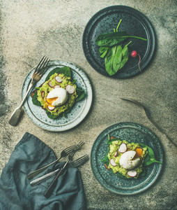 Healthy vegetarian wholegrain avocado toasts with poached egg