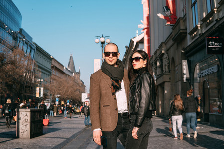 Couple walking and posing on the street