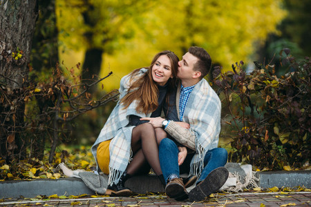 Young couple at the park in autumn season