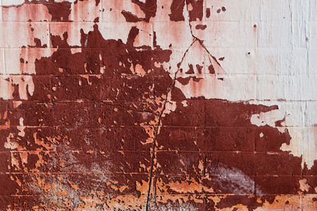 Old cement wall texture background in red tones