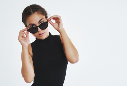 Elegant young woman in trendy sunglasses