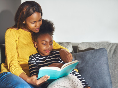 Mom teaching daughter to read
