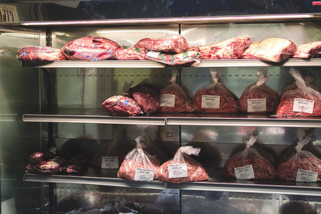 Packages of meat in cooler