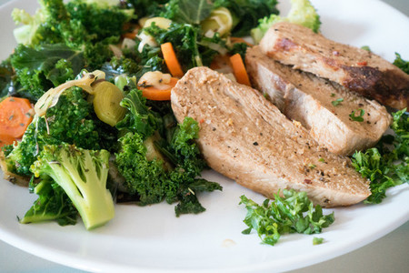 Pork meat with green vegetables