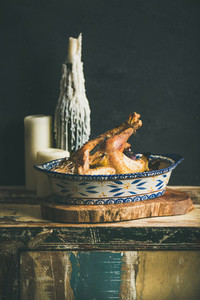 Roasted whole chicken for Christmas black wall background