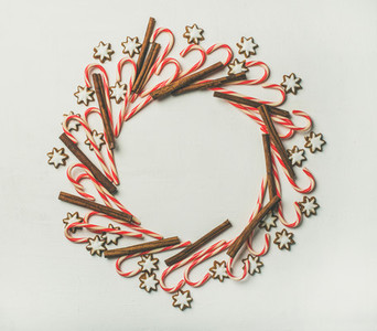 Christmas wreath pattern made from candy cane sticks and cinnamon