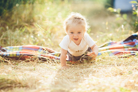 little girl crawling on the lawn