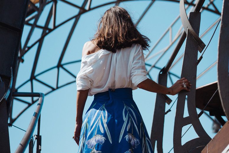 Young girl in a dress posing on a street