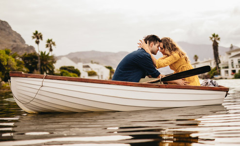 Romantic couple on a boat date in a lake